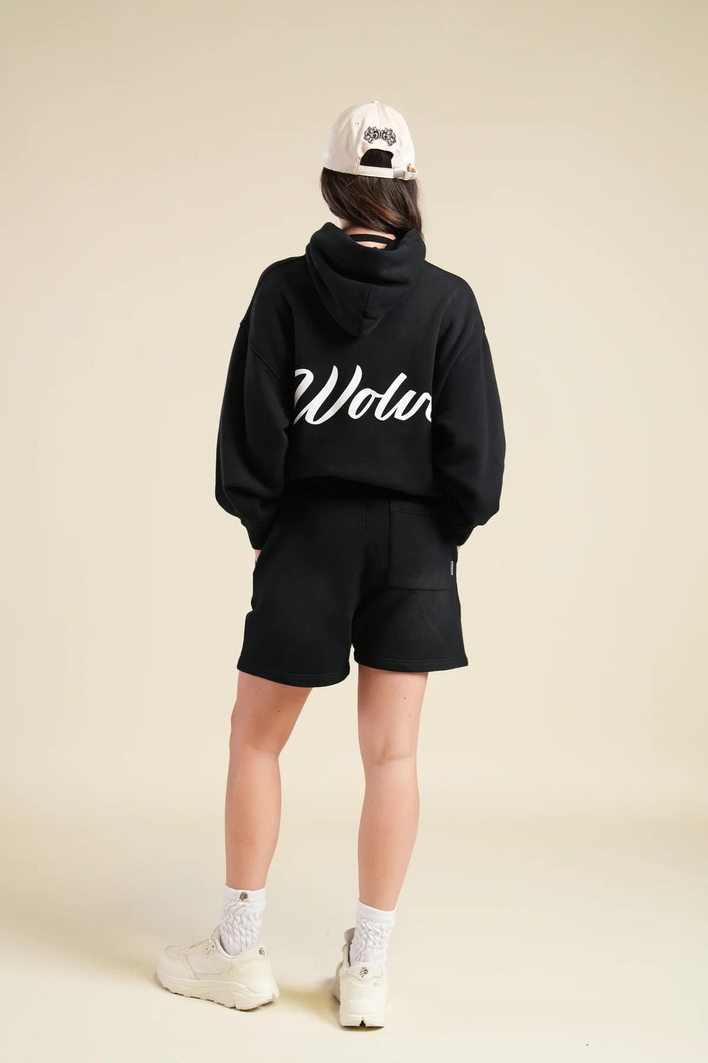 BACK CURSIVE WOLVES "PIERCE" HOODIE IN BLACK SUN FADE