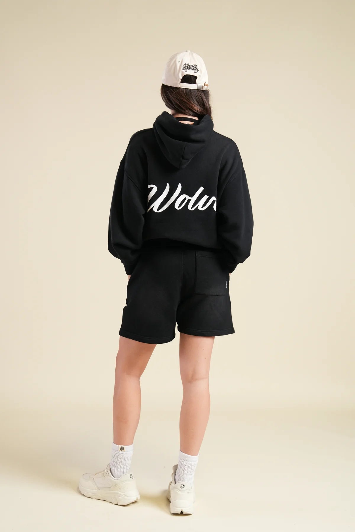 BACK CURSIVE WOLVES "PIERCE" HOODIE IN BLACK SUN FADE