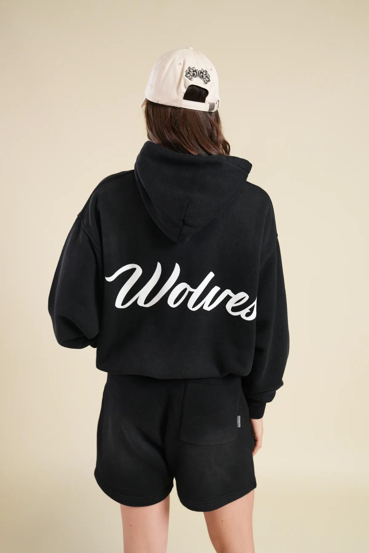 BACK CURSIVE WOLVES "PIERCE" HOODIE IN BLACK SUN FADE