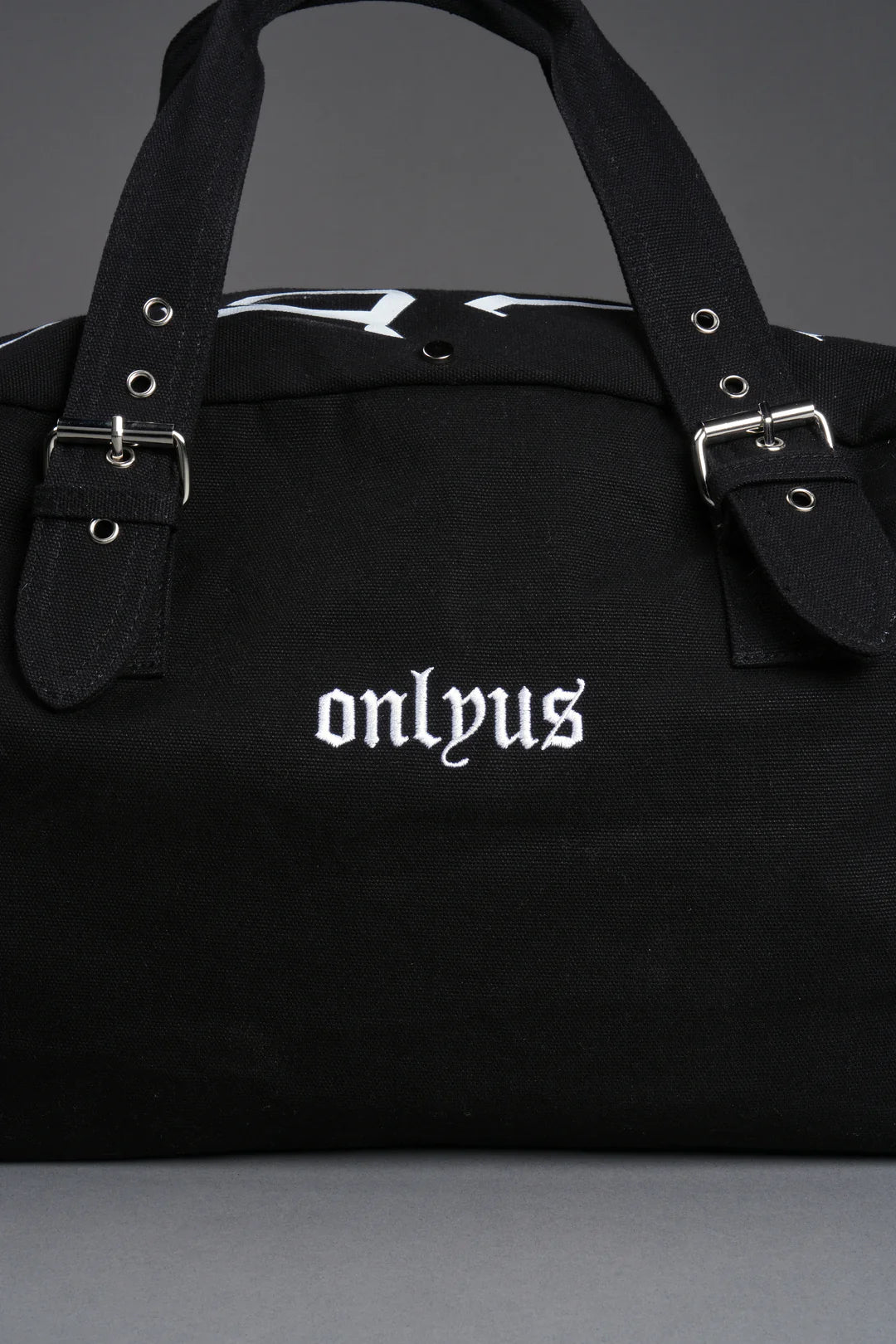 OUR MANTRA DUFFLE SHOULDER BAG IN BLACK