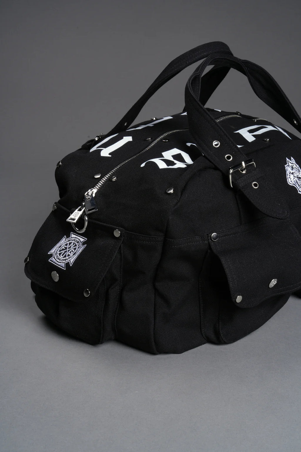OUR MANTRA DUFFLE SHOULDER BAG IN BLACK